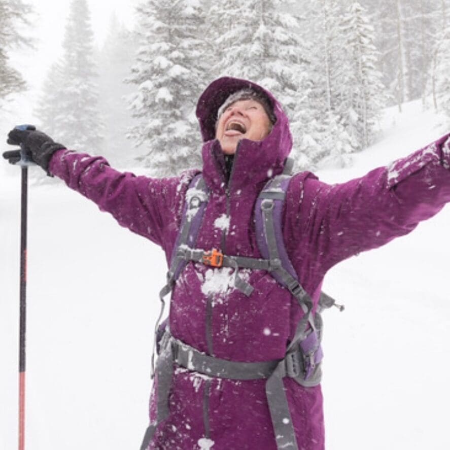 happy woman country skiing